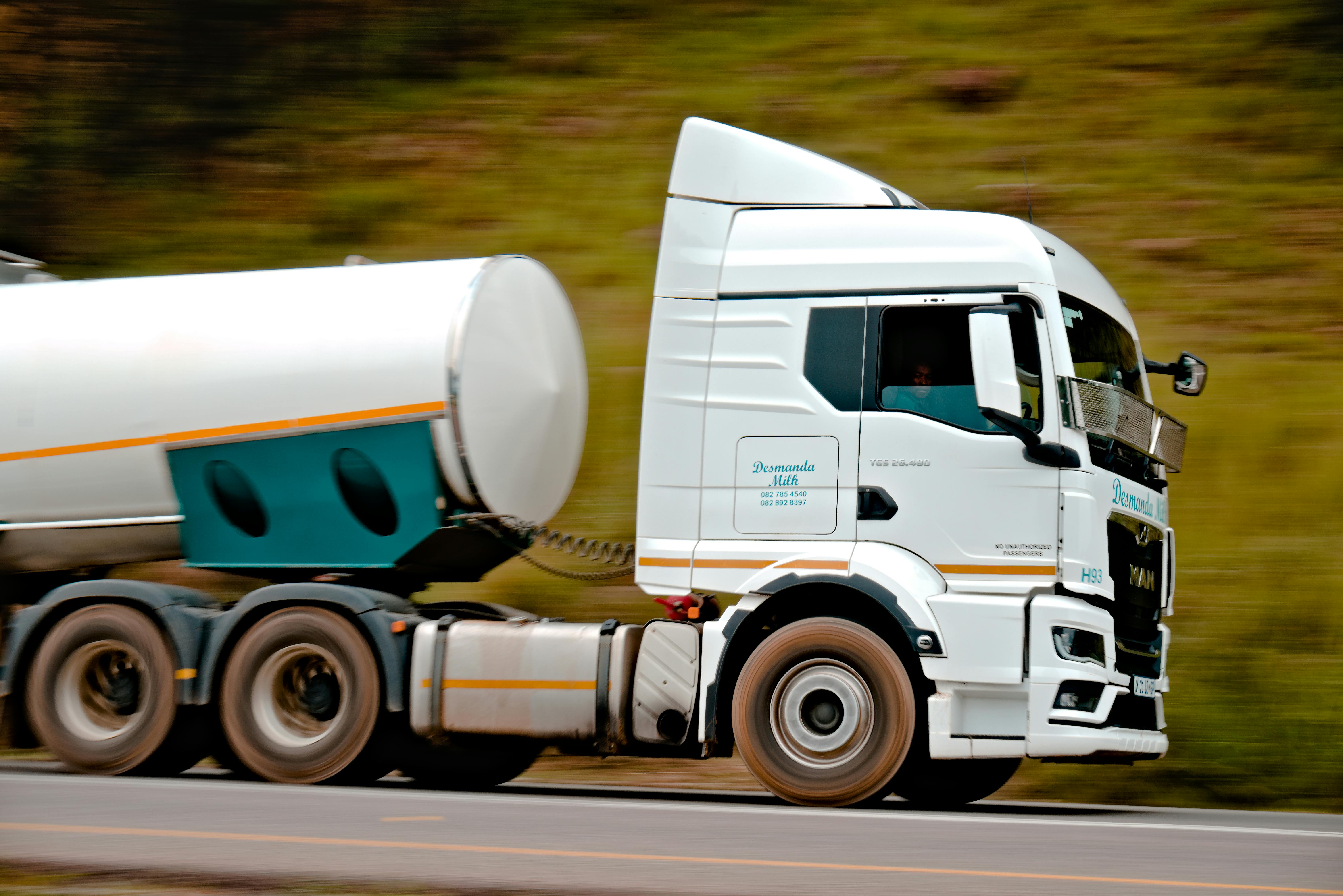 Large blue semi-truck on an open road